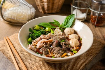 Noodle soup with sliced pork, pig blood,  meatball and Thai morning glory,Nam Tok noodles with thin rice noodles