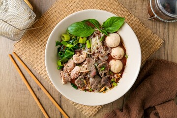 Noodle soup with sliced pork, pig blood,  meatball and Thai morning glory,Nam Tok noodles with thin rice noodles