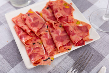 Delicious cabeza meat from fried beef head served on plate for appetizer