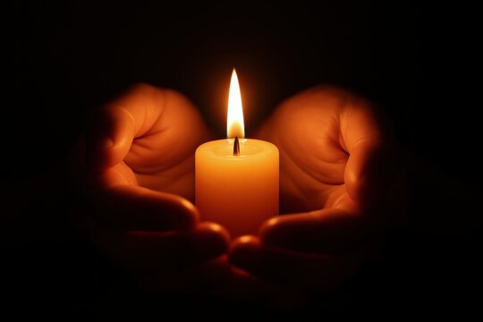 Sacred flame meditation with hands gently holding glowing candle in peaceful spiritual ceremony