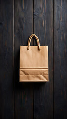Simple Brown Paper Shopping Bag Hanging on Dark Wooden Background Overhead Shot