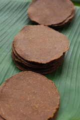 Fermented soybean discs, known as “Thua Nao,” a traditional Thai seasoning used to enhance flavor in Northern cuisine.