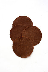 Fermented soybean discs, known as “Thua Nao,” a traditional Thai seasoning used to enhance flavor in Northern cuisine.
