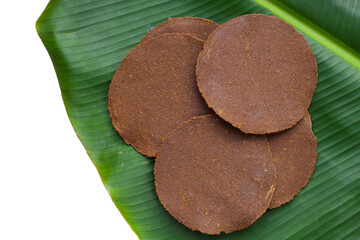 Fermented soybean discs, known as “Thua Nao,” a traditional Thai seasoning used to enhance...