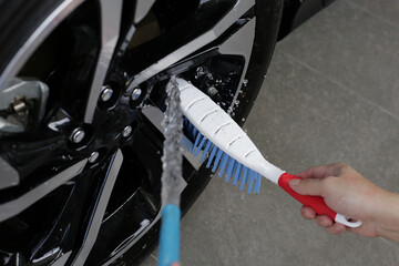 Washing car, cleaning tires and wheels