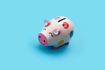 Pinggy bank on blue background.