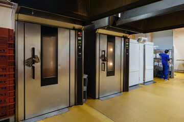 Modern bakery. Industrial ovens for baking bread, loafs, cakes and cookies