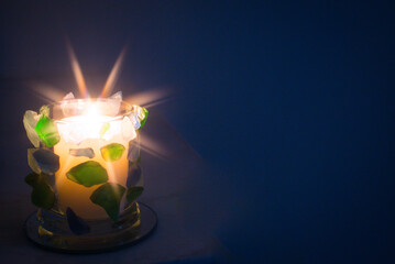 Hand crafted Green and Blue seaglass candle holder.  Star filter used for flame.