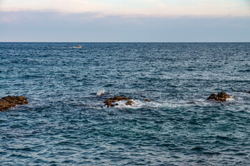 Fototapeta premium rock and wave on the sea