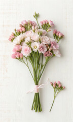 Small bouquet of flowers on a white background. pastel color. light pink. white. copy space. text space. message space