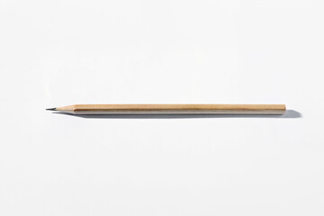 One graphite pencil on white background, above view