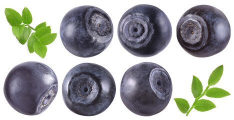 Fresh bilberries and green leaves isolated on white, set