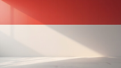 Obraz premium A minimalist interior space featuring a red and white wall with sunlight.