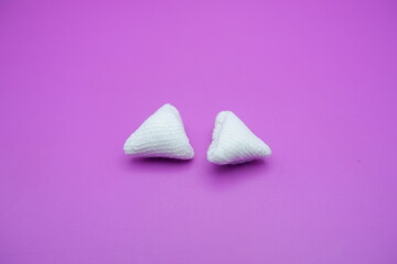 White Folded Gauze on Pink Background