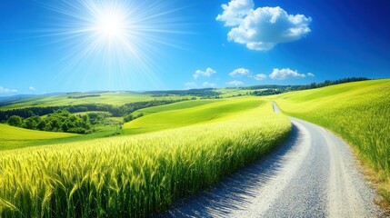 Sunny, winding road through a vibrant green field, leading to hills under a vibrant blue sky