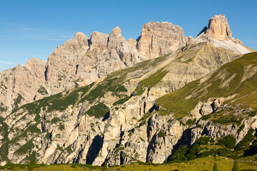 Amazing views of the picturesque high Dolomites mountains, lawns and summer forest