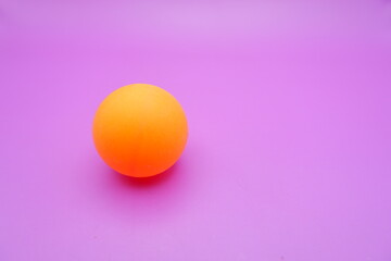 Ping Pong Ball on a Pinkish Purple Background