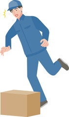 段ボール箱につまずく男性作業員