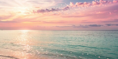 Fototapeta premium Serene ocean horizon at sunset with pink and orange clouds and sparkling water