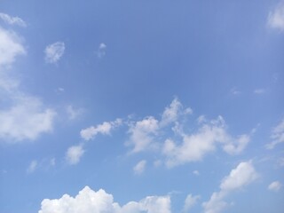 Clear Blue Sky with Fluffy White Clouds Daytime