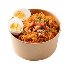 Spicy Korean dried instant noodles with boiled egg, sliced scallions, sesame seed and fresh chili in kraft paper bowl