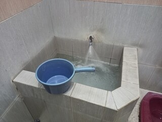 Traditional Indonesian Bathroom Water Basin and Dipper