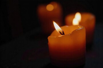 Flickering Candle Flame Macro Close-up of Warm Light in Darkness, Perfect for Meditation, Relaxation, and Spiritual Themes