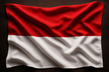 Indonesian National Flag Draped on Wooden Background with Realistic Fabric Texture