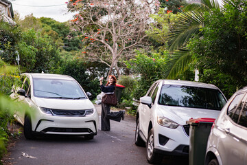 young woman getting a lift with a friend