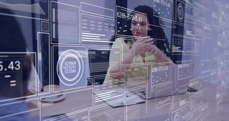 Colleagues settling business meeting and initiating overlay showing data panels reviewing metrics - Powered by Adobe