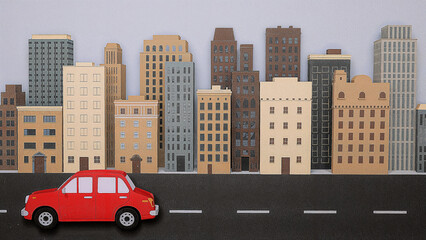 Vibrant papercraft cityscape featuring a red car