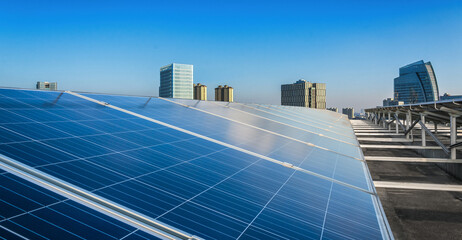 Modern Urban Rooftop with Solar Panels Under Clear Blue Sky