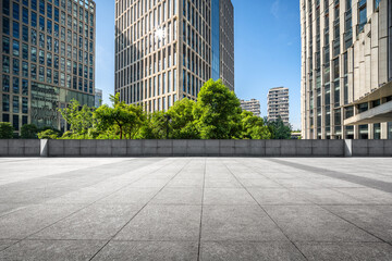 Modern Urban Landscape with Greenery and Skyscrapers Under Clear Blue Sky