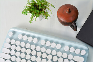 White office desk table with a lot of things on it. Top view with copy space, flat lay.