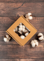 Decorative artificial cotton in a craft box, perfect for handmade decor and gift wrapping. Natural autumn tones for cozy seasonal designs