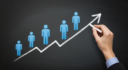 Hand drawing a rising graph with people icons on a chalkboard