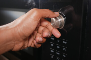 Adjusting microwave settings for cooking time