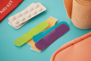 First aid supplies on a blue surface for emergency care