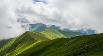 Fototapeta premium Lush Green Mountain Ridges Under a Cloudy Sky, with Hiking Trail