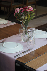 Elegant table with floral centerpiece in restaurant