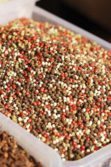 Colorful blend of spices displayed at a market stall