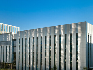 Stunning Modern Architecture Showcasing Innovative Design Against a Clear Blue Sky