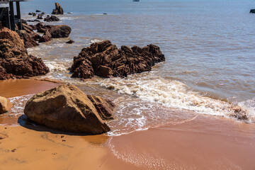 Serene Coastal Landscape with Rocky Shoreline and Gentle Waves