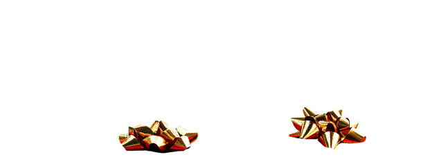 Two gold gift bows on a black background