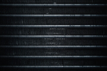 Metallic condenser coil of air conditioner. Aluminum fin coil pattern in condensing unit. Abstract...