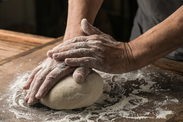 Elderly Hands Kneading Dough for Homemade Bread