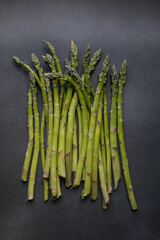Fresh Green Asparagus on Dark Background