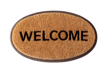 A brown oval doormat with "WELCOME" text, isolated on white.