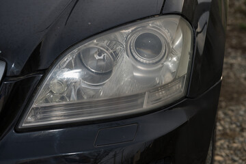 shiny headlights on a black  car
