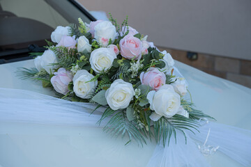 the bride and groom's car decorated with flowers in Transylvania, Romania, 2025